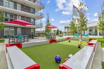 A playground with a slide, ball pit, and climbing wall